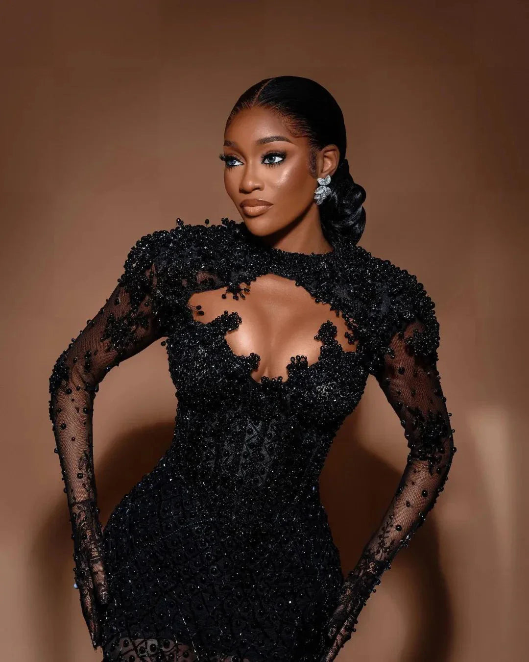 Elegant Black Sheer Beaded Gown with Feather Train