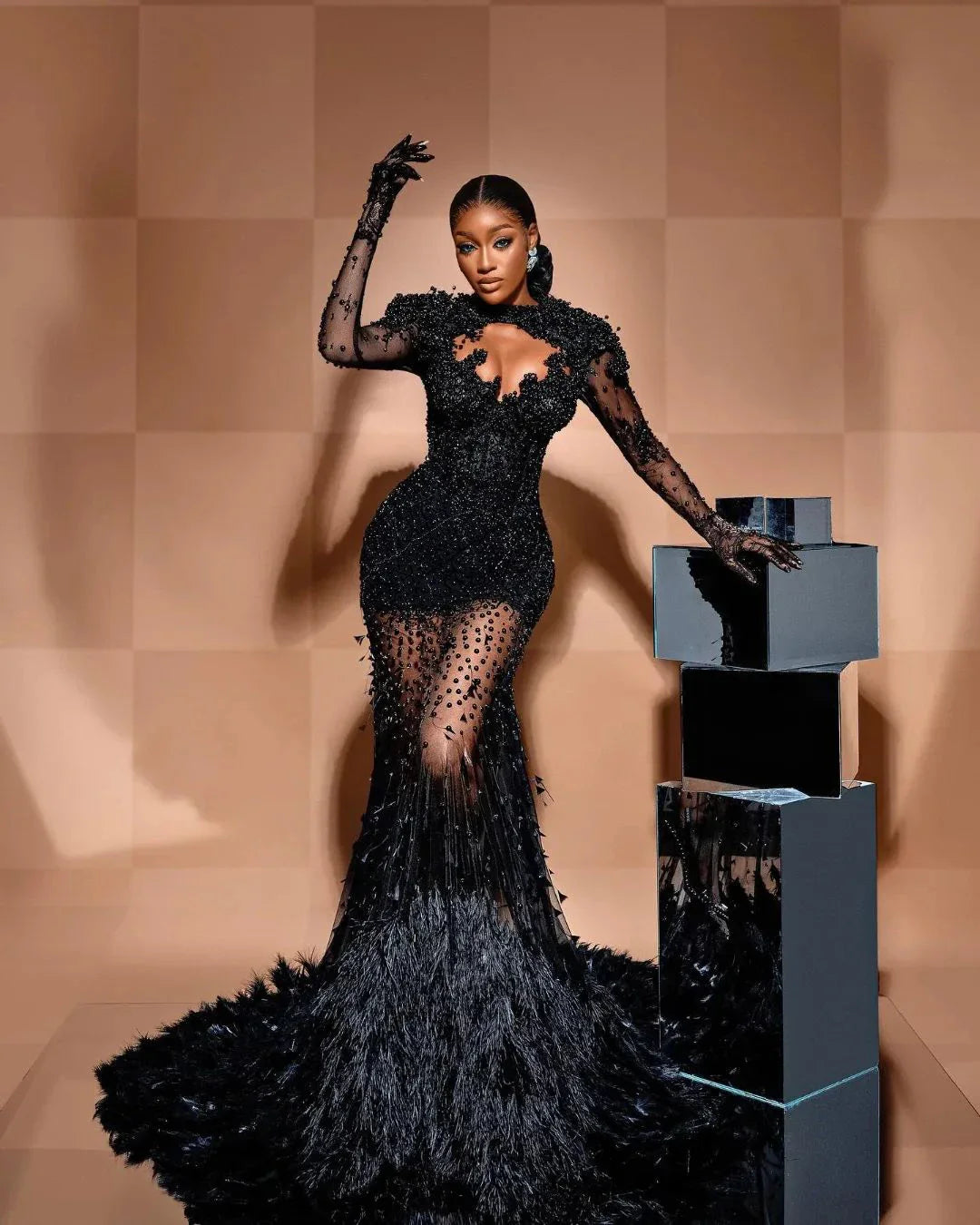 Elegant Black Sheer Beaded Gown with Feather Train